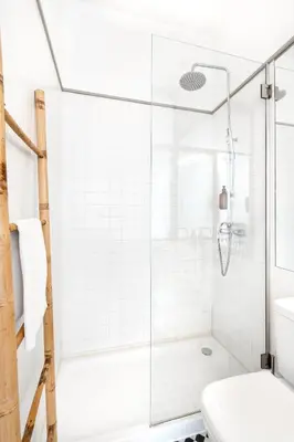 a white bathroom with a shower and a toilet at VIVA Old Street Homes in Porto