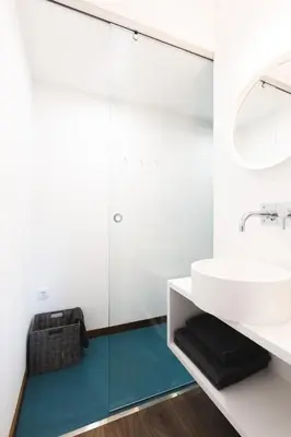 a bathroom with a sink and a mirror at Alegria Cool House in Porto