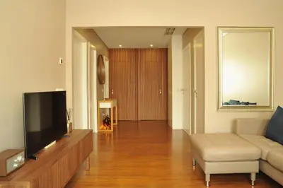 a living room with a flat screen tv and a couch at Music Apartment I in Porto