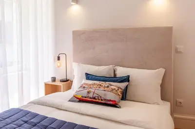 a bedroom with a bed with a pillow on it at D&S -JB Apartments in Porto