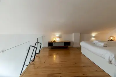 a bedroom with a bed and a desk in a room at Loft Martires da Liberdade by Porto City Hosts in Porto