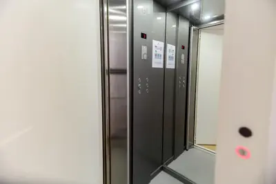 a row of metal elevators in a building at Loft Martires da Liberdade by Porto City Hosts in Porto