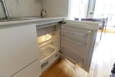 a kitchen with empty drawers and a counter top at Loft Martires da Liberdade by Porto City Hosts in Porto