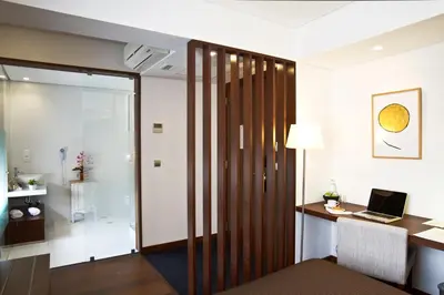 a room with a desk and a laptop on a table at Oca Ribeira do Porto Hotel in Porto