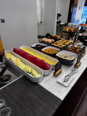 a buffet with many different types of food on a table at Oca Ribeira do Porto Hotel in Porto