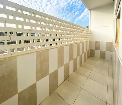 an empty balcony of a building with a window at Convenient 3-Bedroom Apartments next to Bom Sucesso in Porto