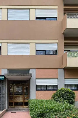 a building with a door and some bushes at Convenient 3-Bedroom Apartments next to Bom Sucesso in Porto
