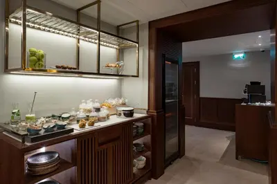 a restaurant with a buffet of food in a room at ICON Duplo Ribeira in Porto