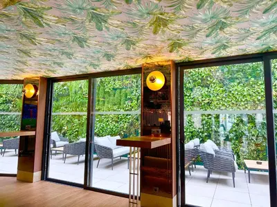 a room with a ceiling covered in plants at TURIM Oporto Hotel in Porto