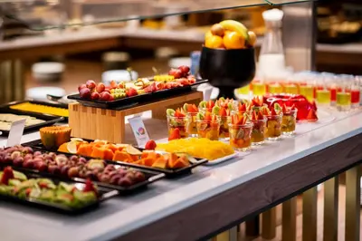 a buffet line with many different types of food at TURIM Oporto Hotel in Porto