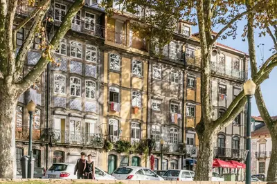 an old building in paris with people standing in front of it at Virtudes Flat in Porto