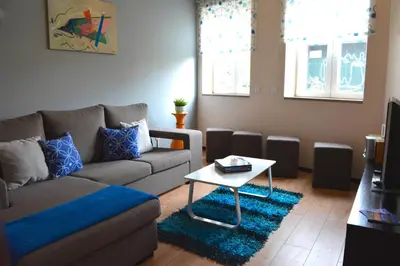 a living room with a couch and a table at Casa do Mirante in Porto