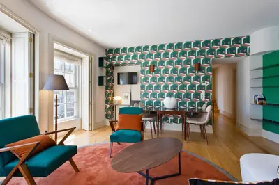 a living room with a table and chairs at BOUTIQUE Rentals-Isabella Ribeira Apt great views in Porto