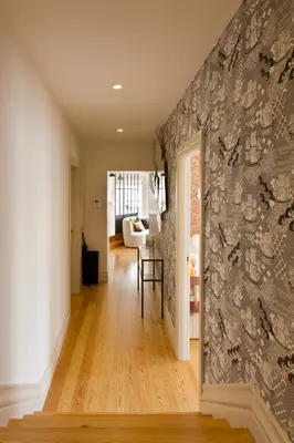 a hallway with a wall covered in wallpaper at BOUTIQUE Rentals-Isabella Ribeira Apt great views in Porto