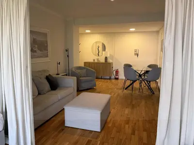 a living room with a couch and a table at Atayde da Câmara - Porto in Porto