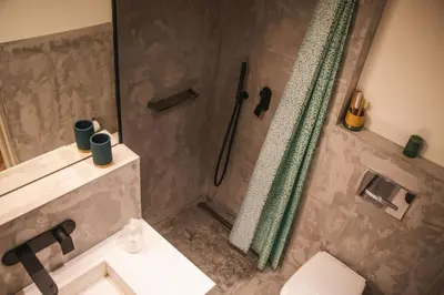 a bathroom with a shower and a toilet and a sink at São Lázaro's Garden - Apartment With Terrace in Porto