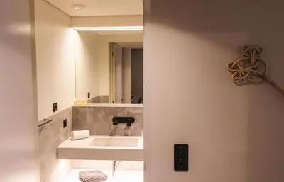 a bathroom with a sink and a mirror at São Lázaro's Garden - Apartment With Terrace in Porto