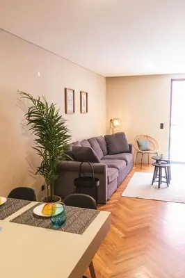 a living room with a couch and a table at São Lázaro's Garden - Apartment With Terrace in Porto