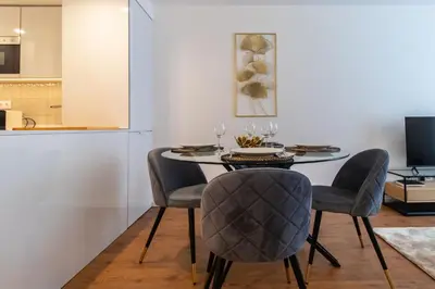 a dining room with a table and chairs at Stunning Apartment w/ Free Parking by LovelyStay in Porto