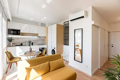 a living room with a couch and a table at Urban House by LovelyStay in Porto