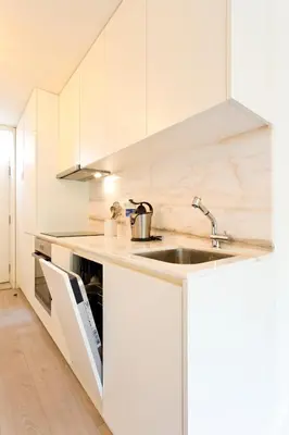 a white bathroom with a toilet and a sink at Zen Garden Studio B in Porto