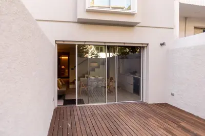 a sliding glass door on the side of a house at Alegria Suítes By Porto City Hosts in Porto