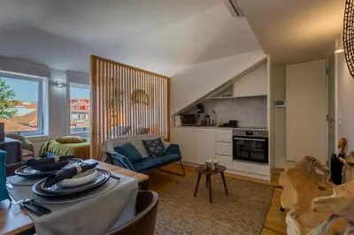 a living room with a couch and a table at OPO Alegria 119 in Porto