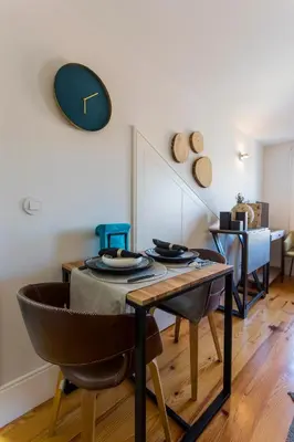 a dining room with a table and chairs at OPO Alegria 119 in Porto