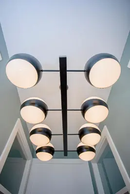 a kitchen with white cabinets and a checkered floor at Liiiving in Porto - Art Design Apartment in Porto