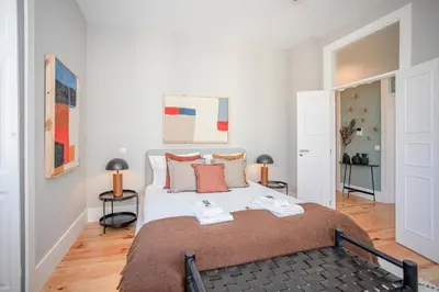 a hallway with wood floors and a ceiling with lights at Liiiving in Porto - Art Design Apartment in Porto
