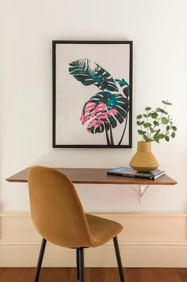 a table with a chair and a picture on a wall at Apartments2Stay I Porto - Flores in Porto