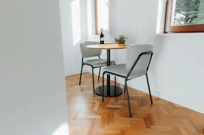 a dining room table with two chairs and a table at JARS Apartments - Casa do Bessa in Porto