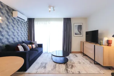a living room with a couch and a tv at HM - ISSY Oporto Apartment in Porto