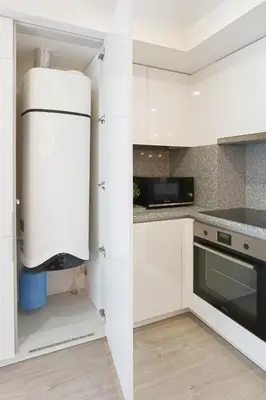 a kitchen with white cabinets and a refrigerator at HM - ISSY Oporto Apartment in Porto