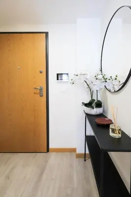 a room with a desk with a mirror and a door at HM - ISSY Oporto Apartment in Porto