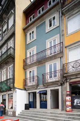 a building with balconies on the side of it at Gharb in Porto