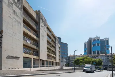 a truck parked in front of a building at Boavista Boho Apartment w/ Garage in Porto