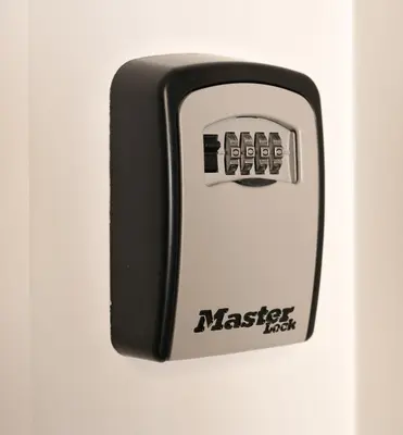 a master lock on a white wall at Strelitzia Apartment, by Bolhão Residences in Porto