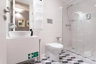 a bathroom with a sink and a toilet and a shower at Lemon Mezzanine - Santa Catarina in Porto