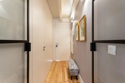 a hallway with a bench and a door at Lemon Mezzanine - Santa Catarina in Porto