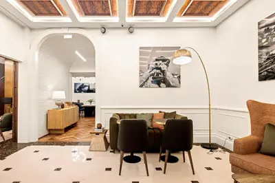 a living room with a table and chairs at 108MM House in Porto