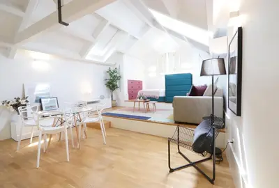 a living room with a table and a couch at Ribeira apartment 6M- vista fabulosa in Porto