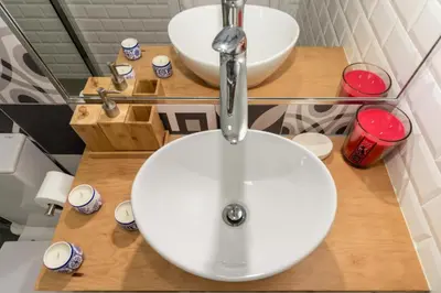 a bathroom with a white sink and a mirror at Oporto Modern Apartments - Campanha Train Station in Porto