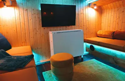 a living room with a tv and a couch at SLEEPBOAT LuxLife Yatch in Porto