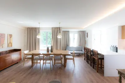 a kitchen and dining room with a table and chairs at Alegria Porto by We Do Living in Porto