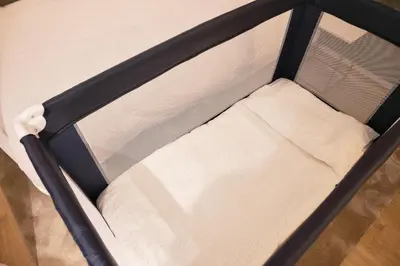 a small bed with a black and white bed frame at Cactus Apartment, by Bolhão Residences in Porto