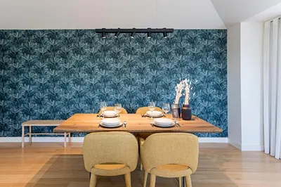 a dining room with a wooden table and chairs at Aliados Premium 1BR w/ Terrace by LovelyStay in Porto