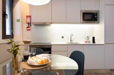 a kitchen with a table with a plate of food on it at Savannah Apartment, by Bolhão Residences in Porto