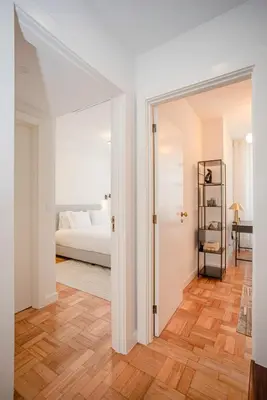 a bedroom with a bed and a door leading to a bedroom at Liiiving in Porto - Design Bright House in Porto