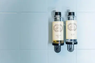 two bottles of liquids sitting on a wall at Dream Views of Porto - Private Apt in Gaia by Lisbeyond in Vila Nova de Gaia